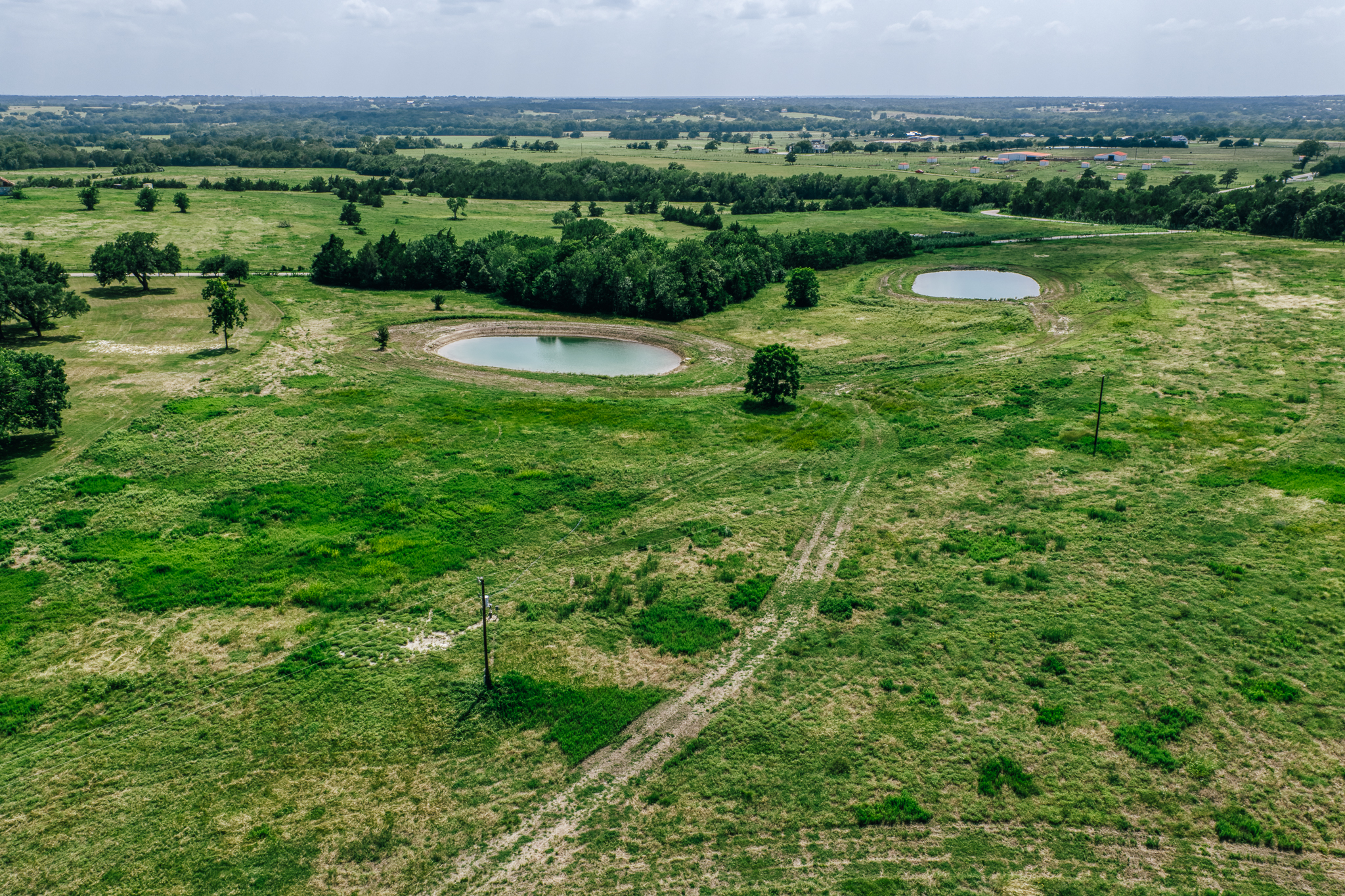 Full-property aerial showing scale and multiple ponds — Lot 2