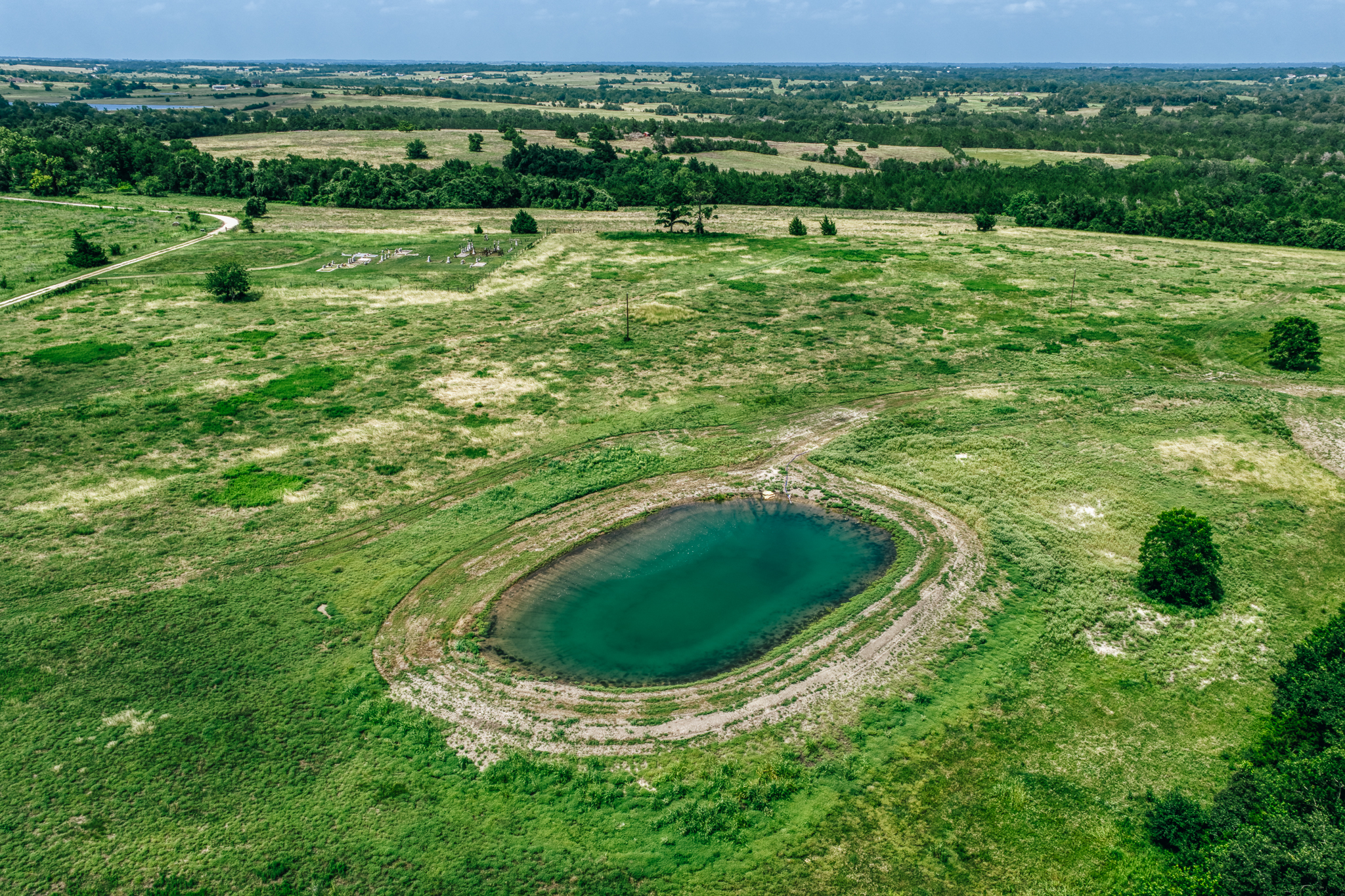 Aerial of Lot 1 — single pond, wide green fields