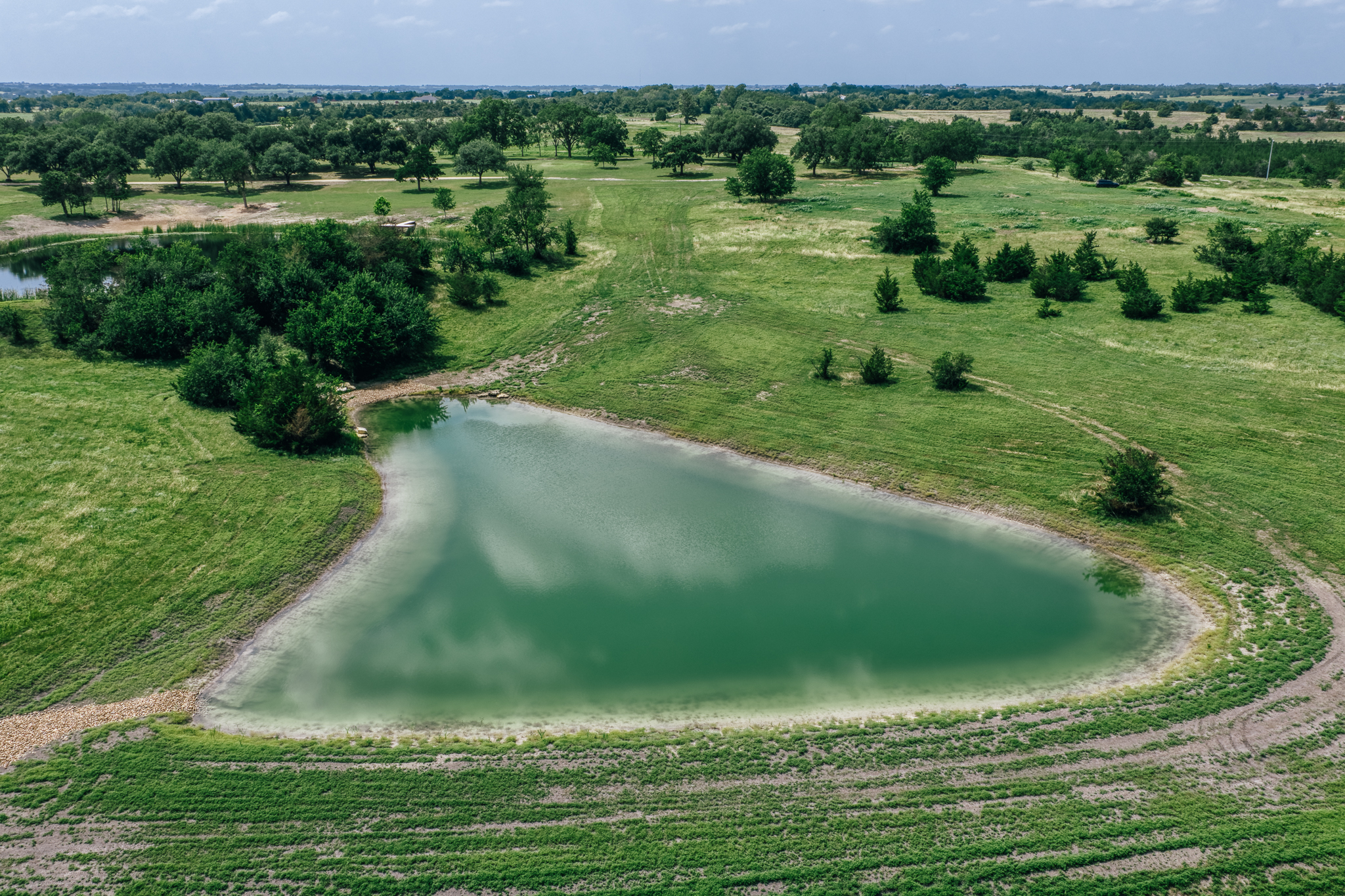 Aerial of Lot 4 — open landscape and ponds